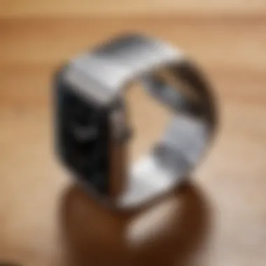 The Apple Watch aluminium band paired with the watch on a wooden surface